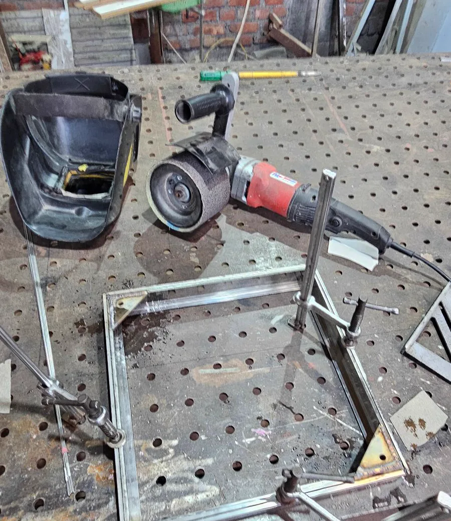 Stainless steel chamber cover frame clamped with corner plates on welding table